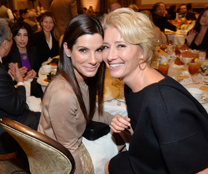 BEVERLY HILLS, CA - JANUARY 10:  Actors Sandra Bullock (L) and Emma Thompson attend the 14th annual AFI Awards Luncheon at the Four Seasons Hotel Beverly Hills on January 10, 2014 in Beverly Hills, California.  (Photo by Alberto E. Rodriguez/Getty Images for AFI)